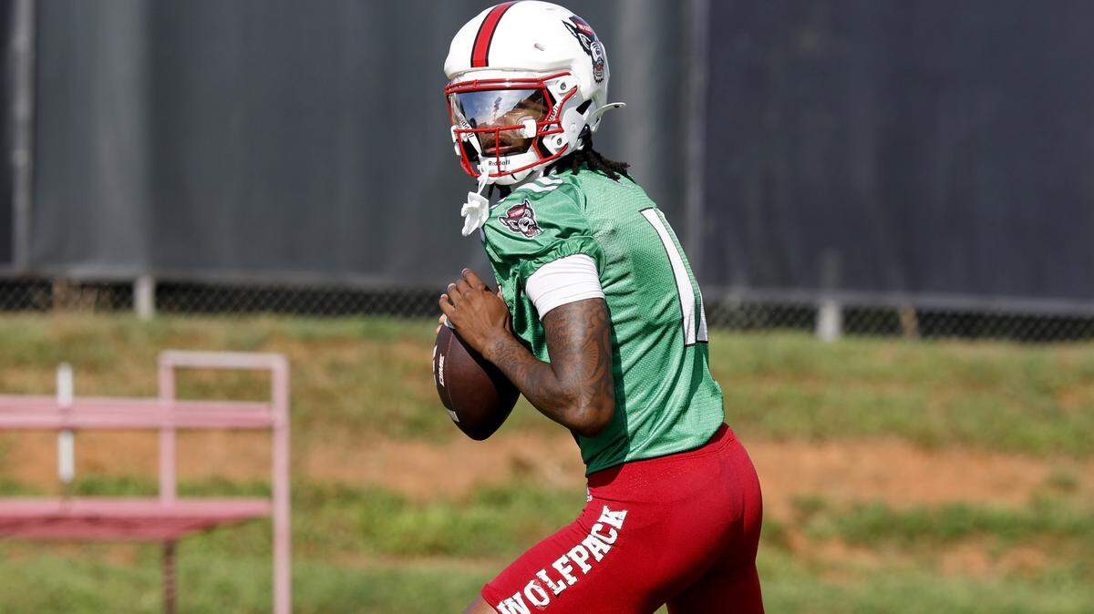N.C. State quarterback CJ Bailey (11) prepares to throw during the Wolfpack’s first fall practice Wednesday, July 30, 2025.