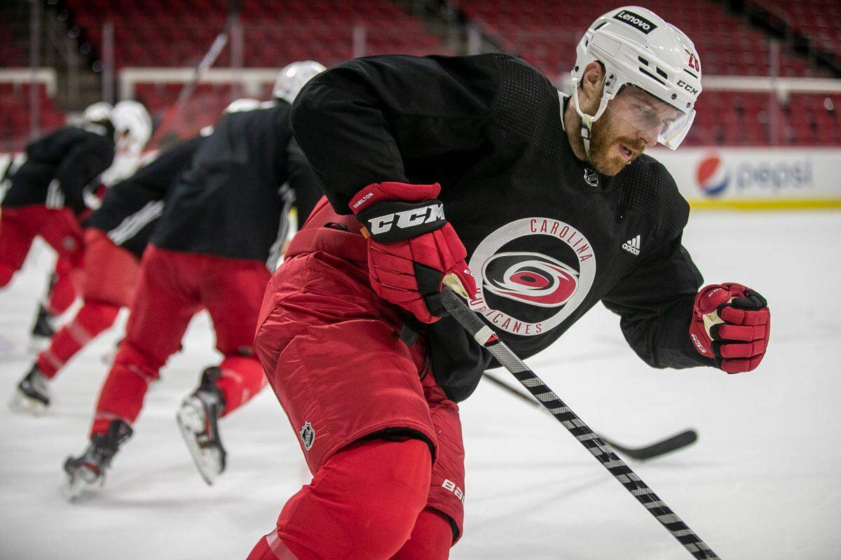 Carolina Hurricanes’ Ian Cole (28) does sprints with teammates during the opening day of training camp on Thursday, September 23, 2021 at PNC Arena in Raleigh, N.C.