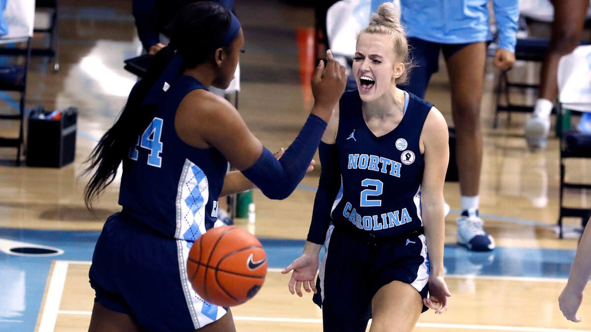 North Carolina’s Petra Holesinska (2) celebrates with Janelle Bailey (44) after Bailey scored while being fouled during the second half of UNC’s 76-69 victory over N.C. State at Carmichael Arena in Chapel Hill, N.C., Sunday, February 7, 2021.