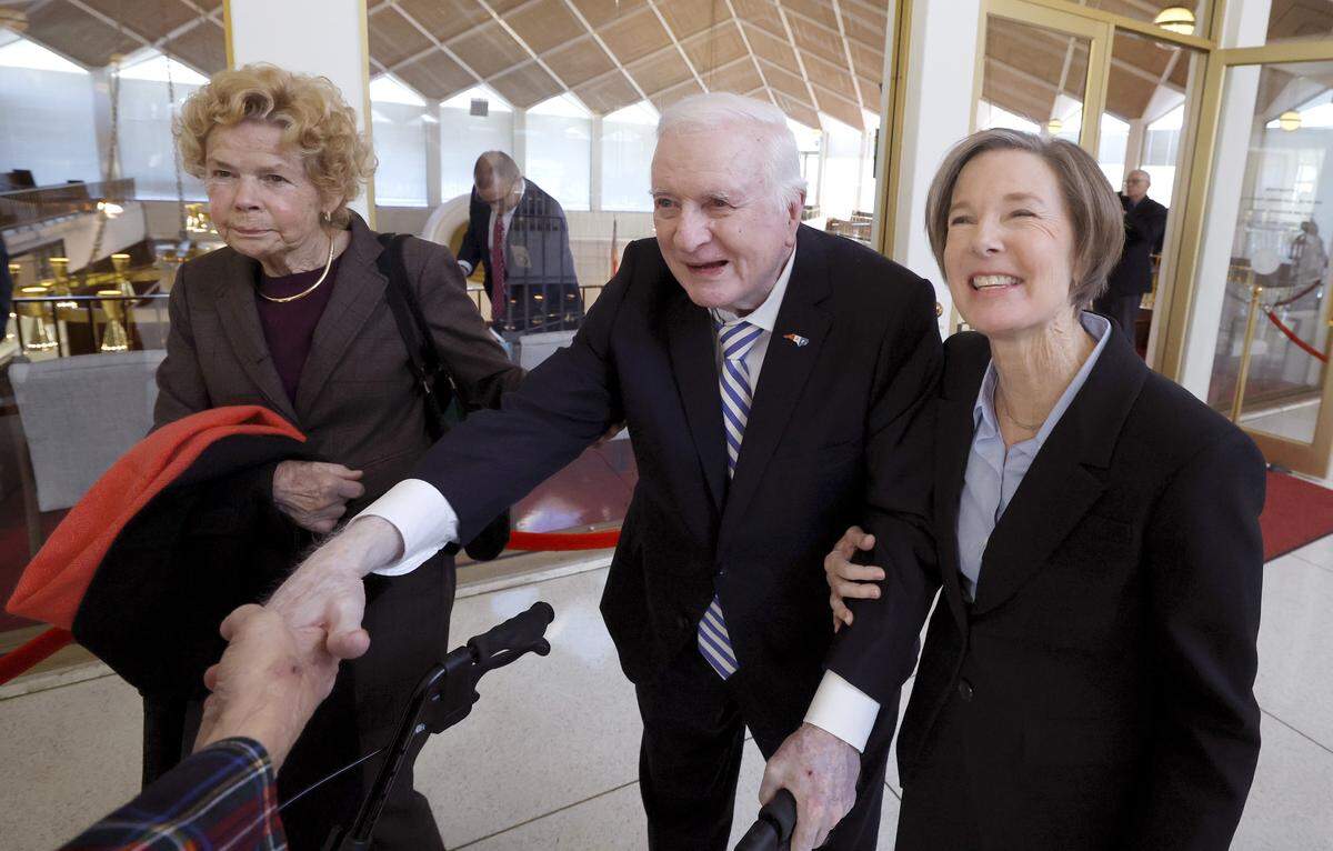 Former Gov. Jim Hunt, along with his wife Carolyn and daughter Lt. Gov. Rachel Hunt, greet well wishers after the opening session of N.C. Senate Wednesday, Jan. 8, 2025. 