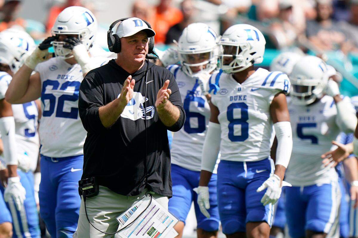 Duke head coach Mike Elko watches from the sidelines during the first half of an NCAA college football game against Miami, Saturday, Oct. 22, 2022, in Miami Gardens, Fla. (AP Photo/Wilfredo Lee)
