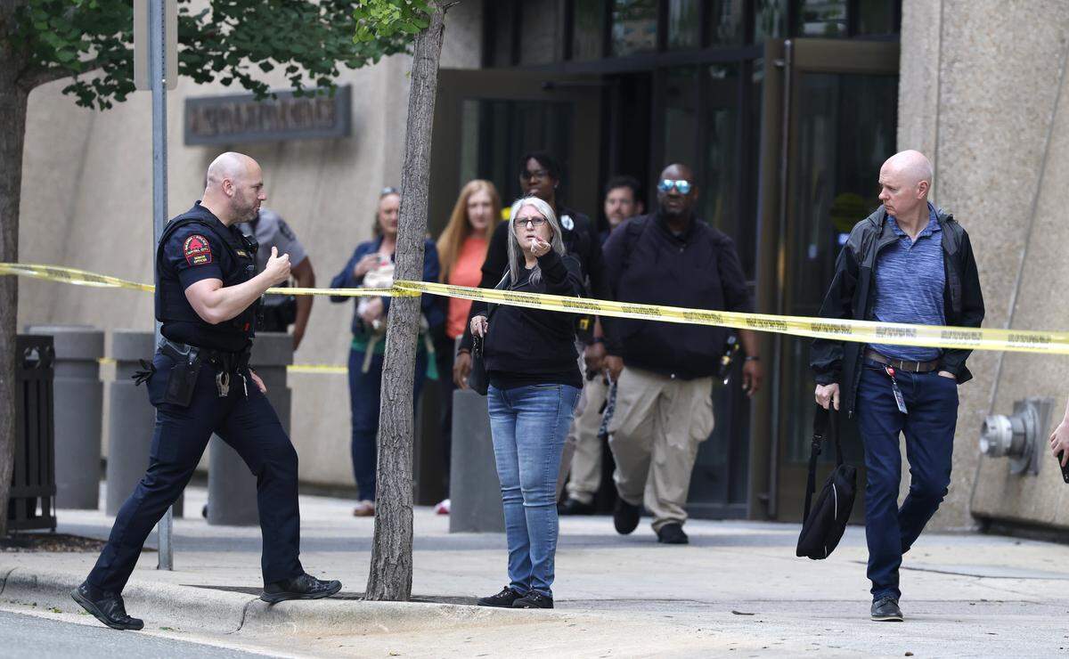 People leave the Wake County Courthouse early Friday afternoon May 22, 2026. The courthouse closed early after two individuals were shot outside the courthouse Friday morning.
