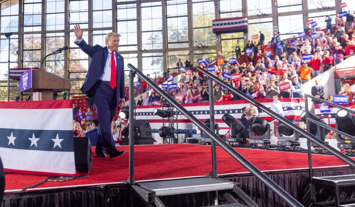Republican presidential nominee and former President Donald Trump leaves the stage following a rally at Dorton Arena in Raleigh on Monday, Nov. 4, 2024, one day before Election Day.