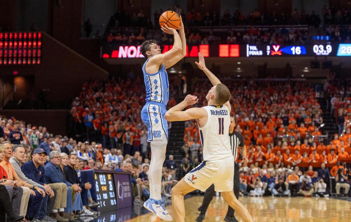 North Carolina’s Cormac Ryan (3) launches a three-point shot in the first half against Virginia’s Isaac McKneely (11) on Saturday, February 24, 2024 at John Paul Jones Arena in Charlottesville, Va.