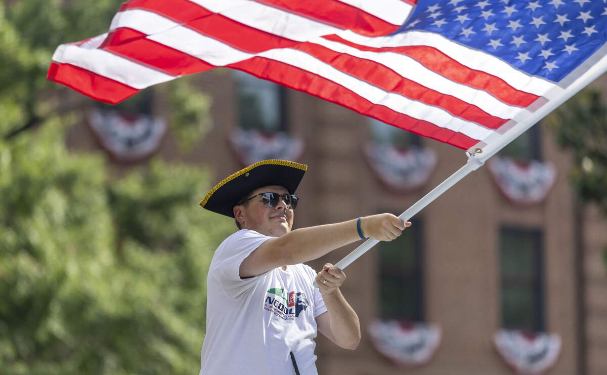 David Capen, from the North Carolina Department of Labor, waves the American Flag, during the First in Freedom Parade on Saturday, July 4, 2026 in Raleigh, N.C.