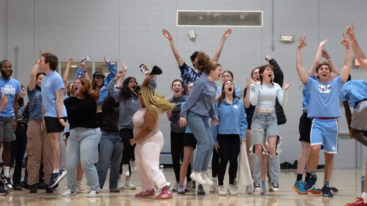 Daily Tar Heel editors and staffers share smiles during the rivarly basketball game against The Chronicle in Brodie Recreation Center on Saturday, Jan. 24, 2025. DTH beat The Chronicle 2-1.