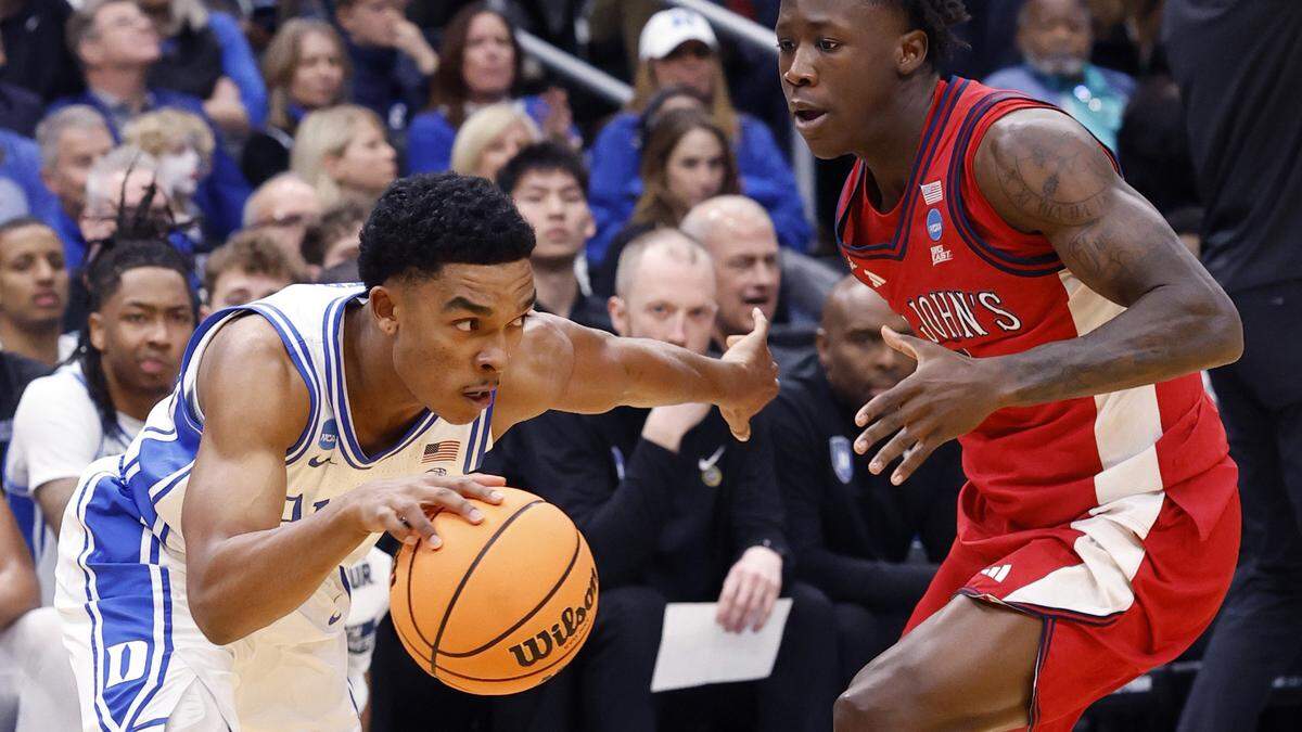 Duke’s Caleb Foster drives past St. John's Joson Sanon during the first half of Duke’s game against St. John’s in the Sweet 16 of the NCAA Men’s Basketball East Regional at Capital One Arena in Washington, D.C., Friday, March 27, 2026.
