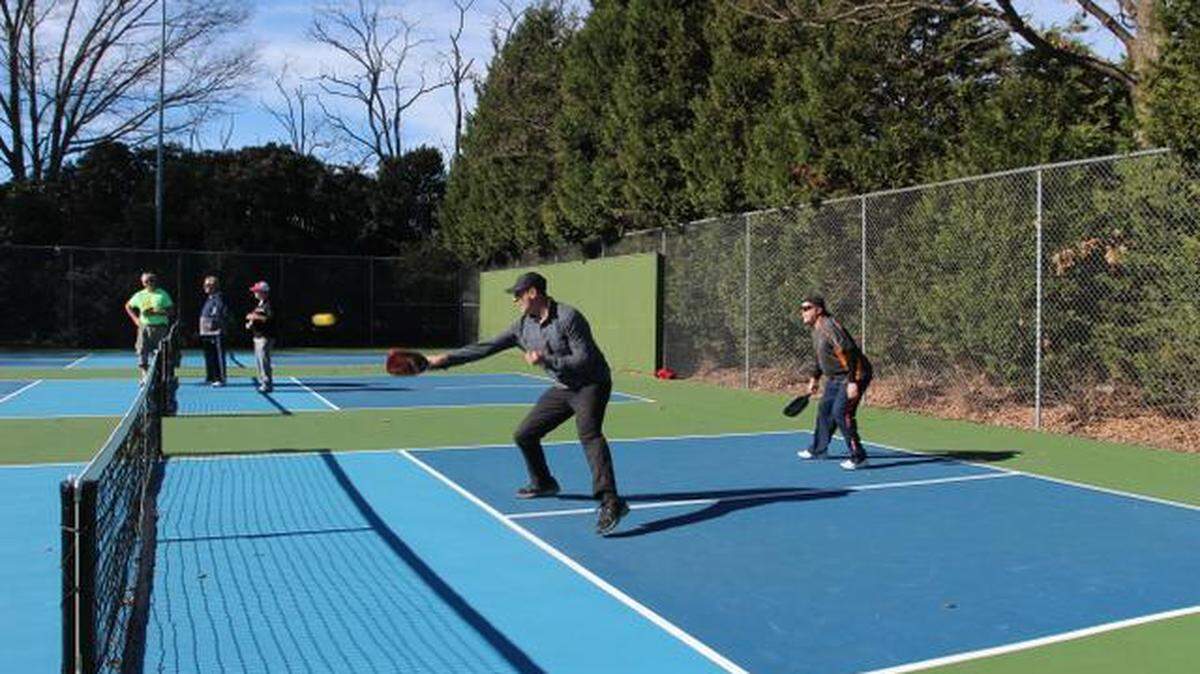 Jay Smith plays pickleball on the new outdoor courts at Method Community Park in Raleigh. They were the first permanent pickleball courts in the city.