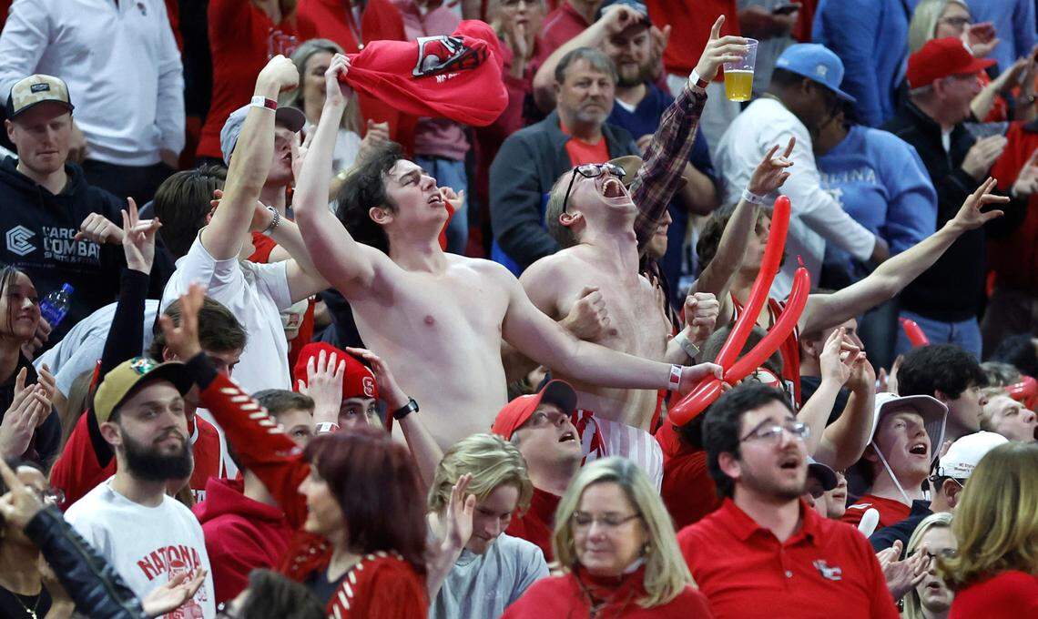 Wolfpack fans celebrate in the second half of N.C. State’s 77-69 victory over UNC at PNC Arena in Raleigh, N.C., Sunday, Feb. 19, 2023.