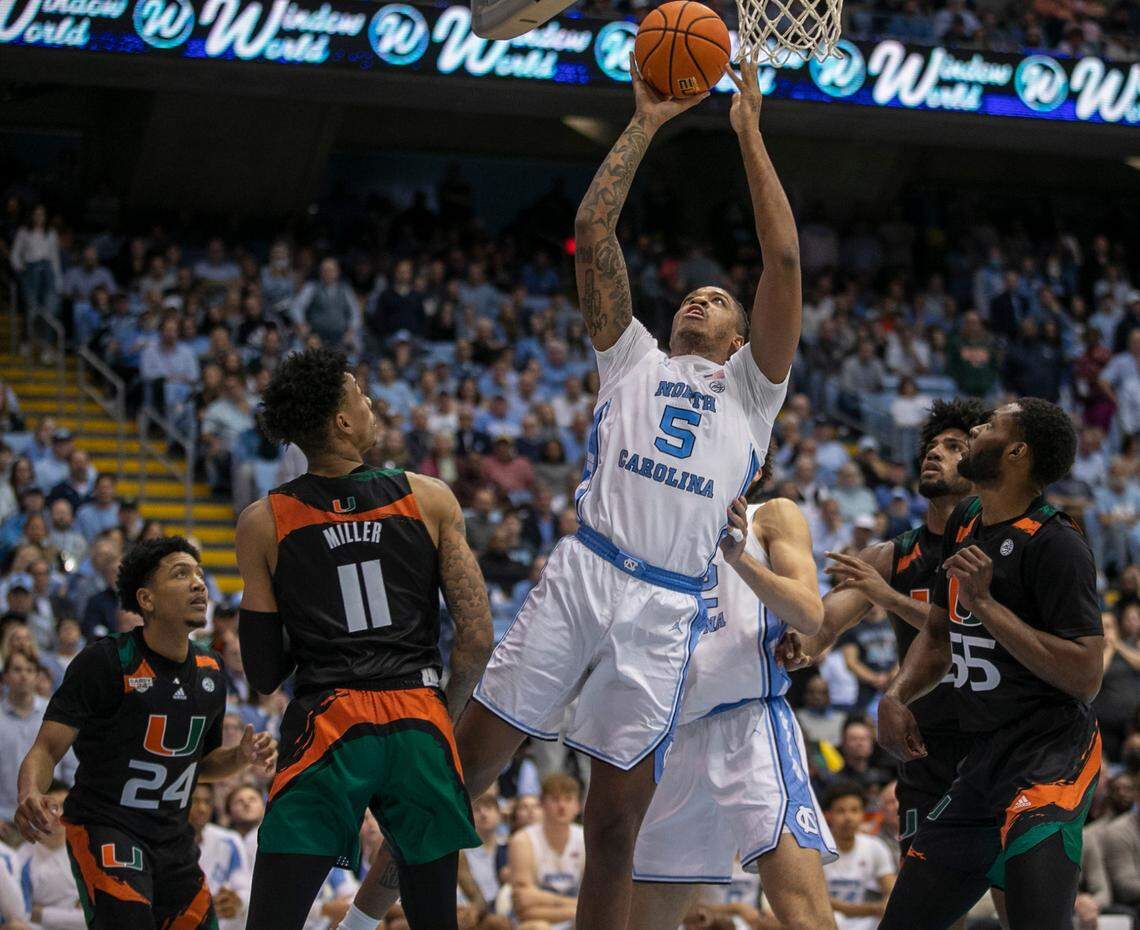 North Carolina’s Armando Bacot (5) muscles his way to the basket against Miami’s Jordan Miller (11) in the second half on Monday, February 13, 2023 at the Smith Center in Chapel Hill, N.C.