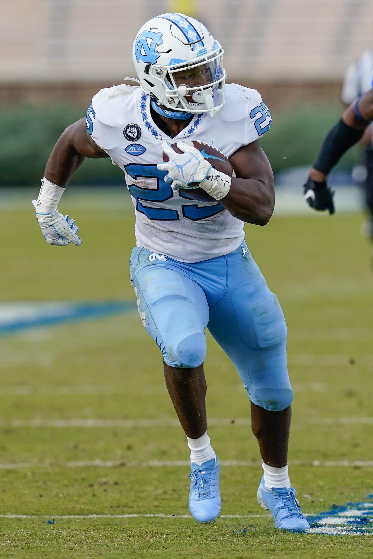 North Carolina Tar Heels running back Javonte Williams (25) runs the ball against the Duke Blue Devils during the second half at Wallace Wade Stadium. 