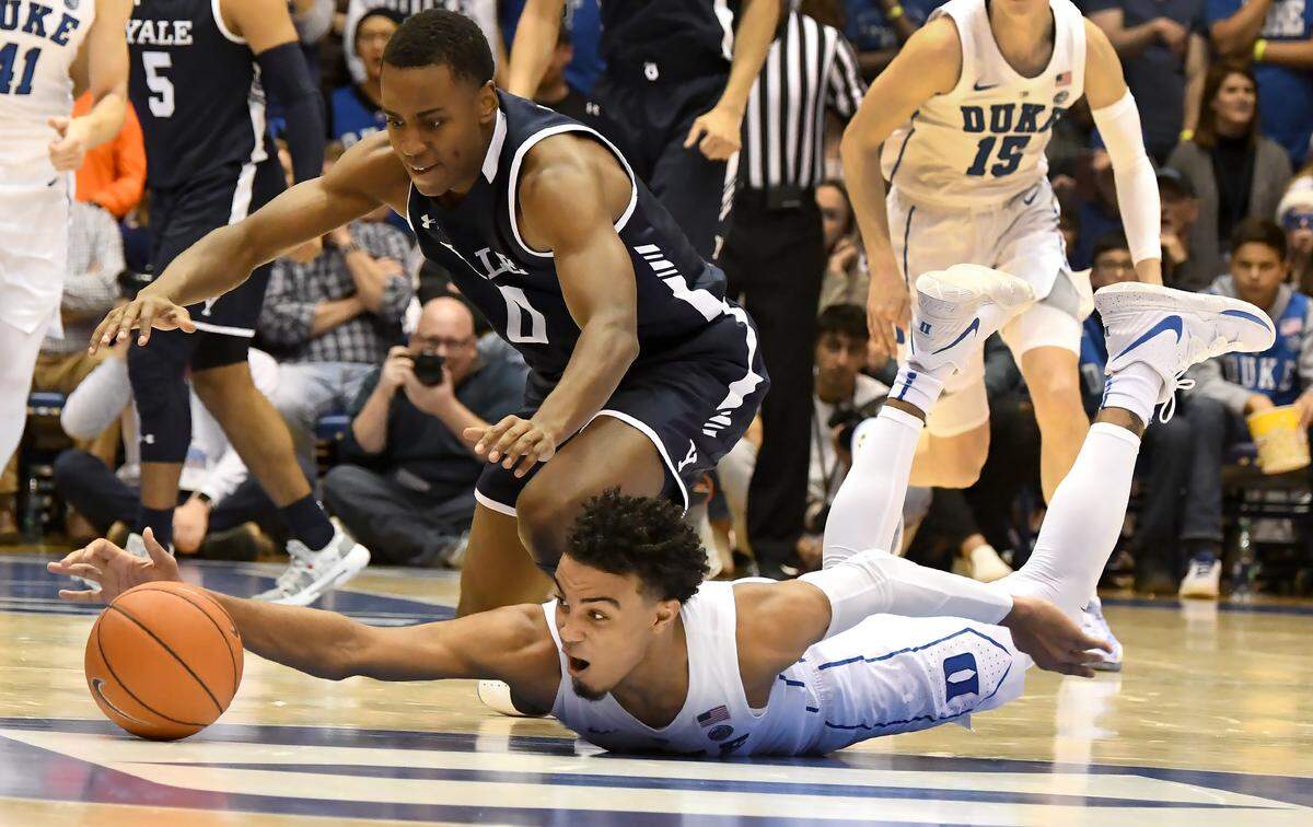 Duke guard Tre Jones (3) and Yale guard Jalen Gabbidon (0) scramble for a loose ball in the first half of play at Cameron Indoor Stadium In Durham, N.C. Saturday, Dec. 8, 2018.