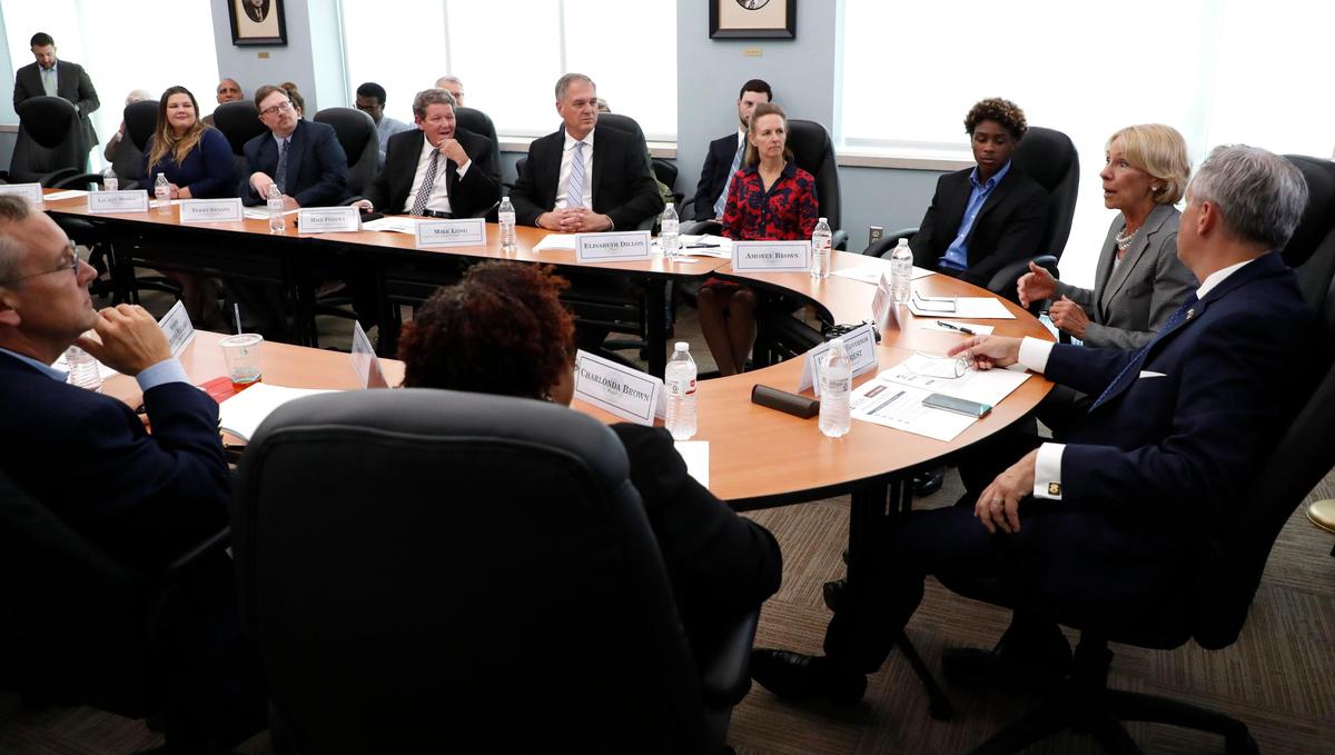 U.S. Education Secretary Betsy DeVos, right, leads a discussion about Education Freedom Scholarships, a new federal school choice program, during a roundtable at the N.C. Museum of Natural Science in Raleigh, N.C., Wednesday, July 17, 2019.