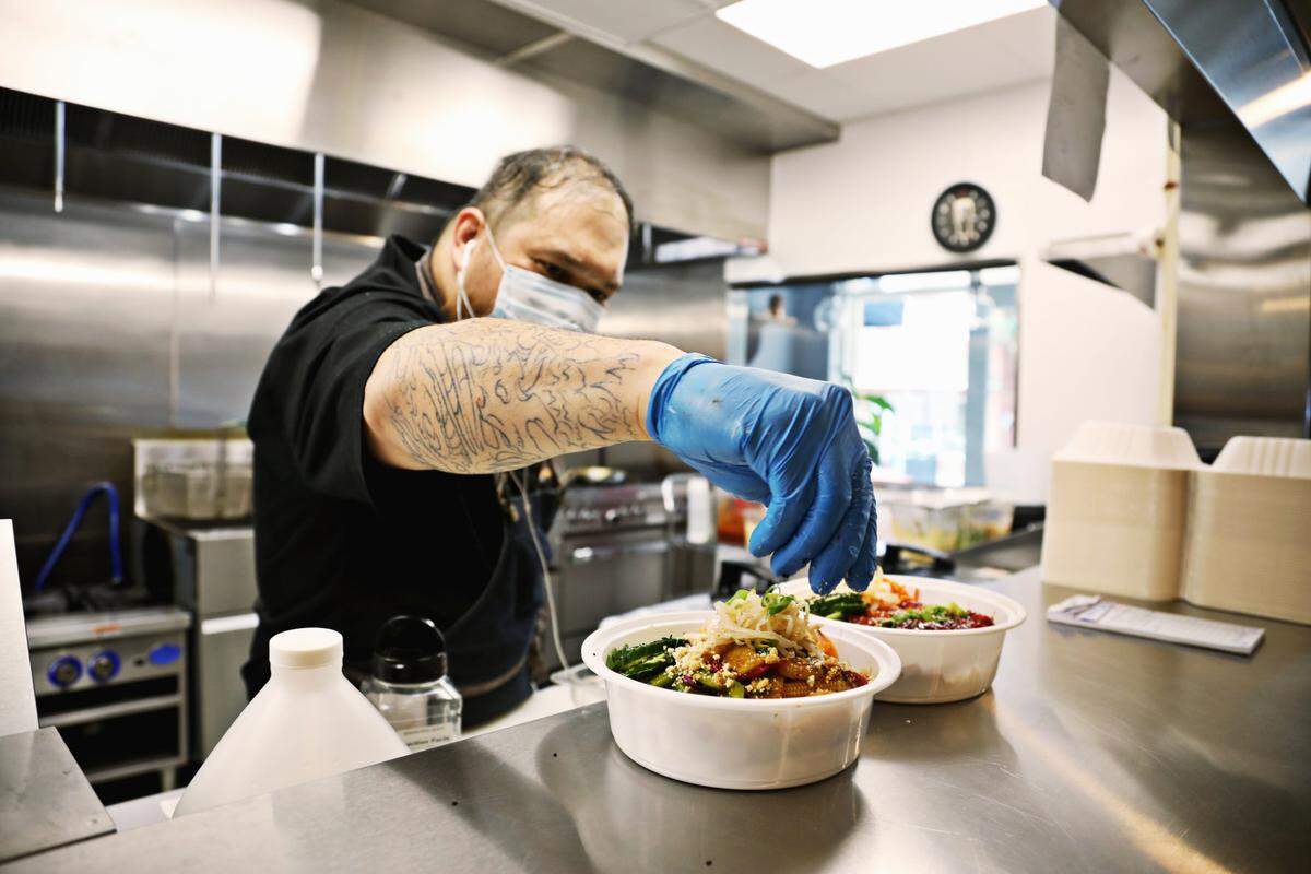 Chef RJ St. John works in the kitchen at The Nomad in downtown Hillsborough on Wednesday, Aug. 19, 2020. The restaurant opened during the pandemic and has adjusted the menu to offer take-out to accommodate customers.