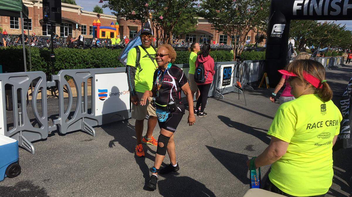 Kandaree Dawkins crosses the finish line at the Rex Wellness Sprint Triathlon.