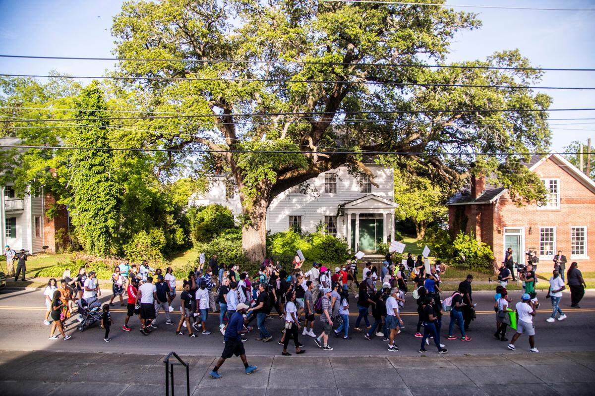 Demonstrators march in Elizabeth City Tuesday, May 18, 2021 after Pasquotank County District Attorney Andrew Womble announced he will not charge deputies in the April 21 fatal shooting of Andrew Brown Jr.