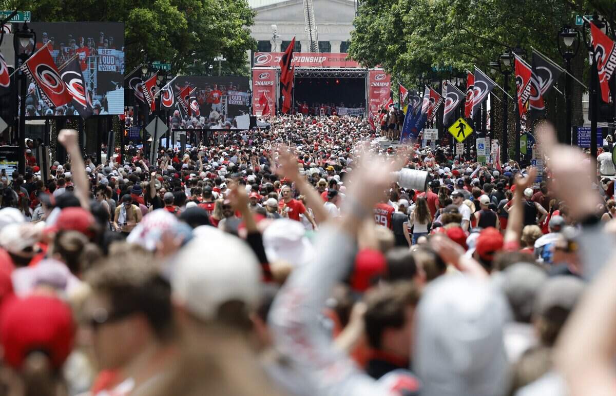Canes fans fill Fayetteville St. in downtown Raleigh as they watch the rally for the Carolina Hurricanes Saturday, June 20, 2026.