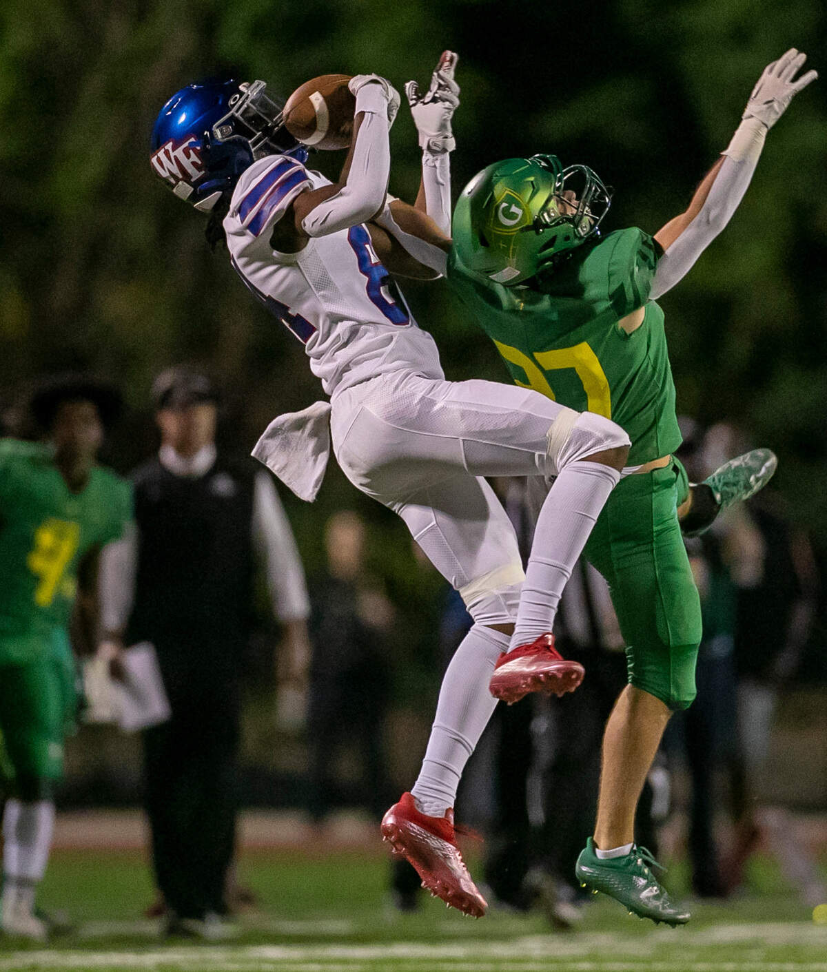 Wake Forest’s Frank Baret (84) pulls in a long pass over Cardinal Gibbons’ Nolan Wirick (27) in the second quarter on Friday, September 9, 2022 at Cardinal Gibbons High School in Raleigh, N.C.