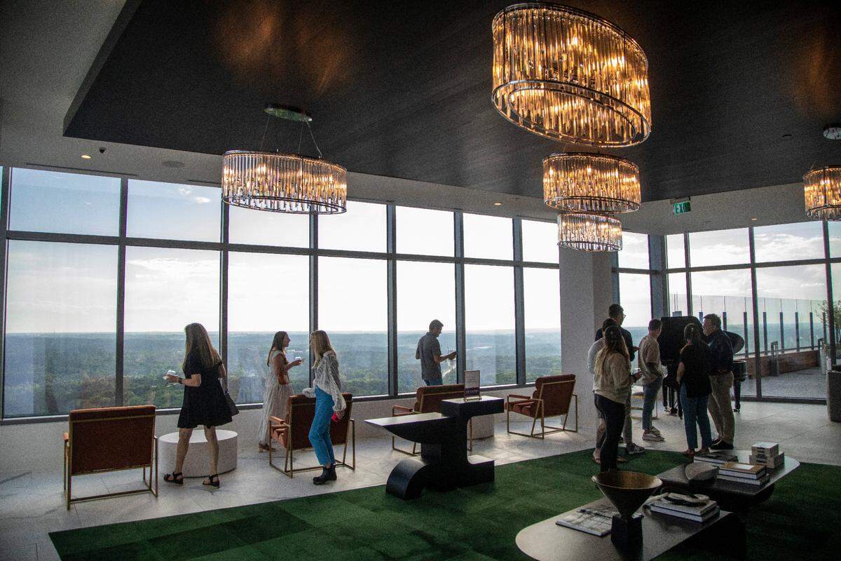 Potential renters tour Kane Realty’s 36-story luxury apartment tower off Six Forks Road called the Eastern Residences at North Hills in Raleigh Friday, May 6, 2022.