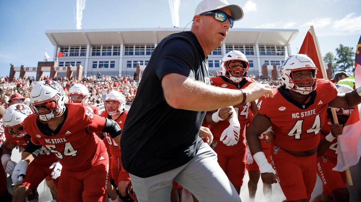 N.C. State head coach Dave Doeren takes the field with his players prior to the Wolfpack’s game against Campbell on Saturday, Oct. 4, 2025, at Carter-Finley Stadium in Raleigh, N.C.