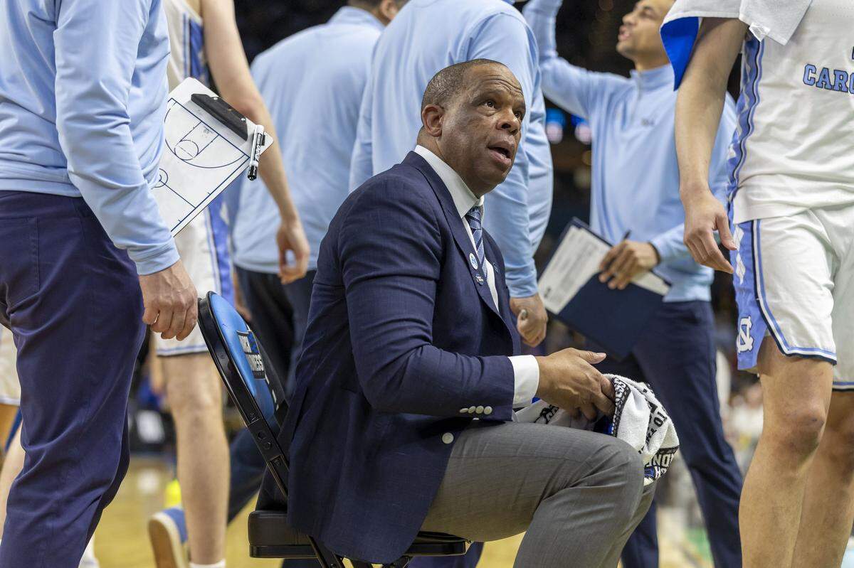 North Carolina coach Hubert Davis huddles with his team during a time out in the first half against VCU on Thursday, March 18, 2026, during the first round of the NCAA Tournament at Bon Secours Arena in Greenville, S.C.
