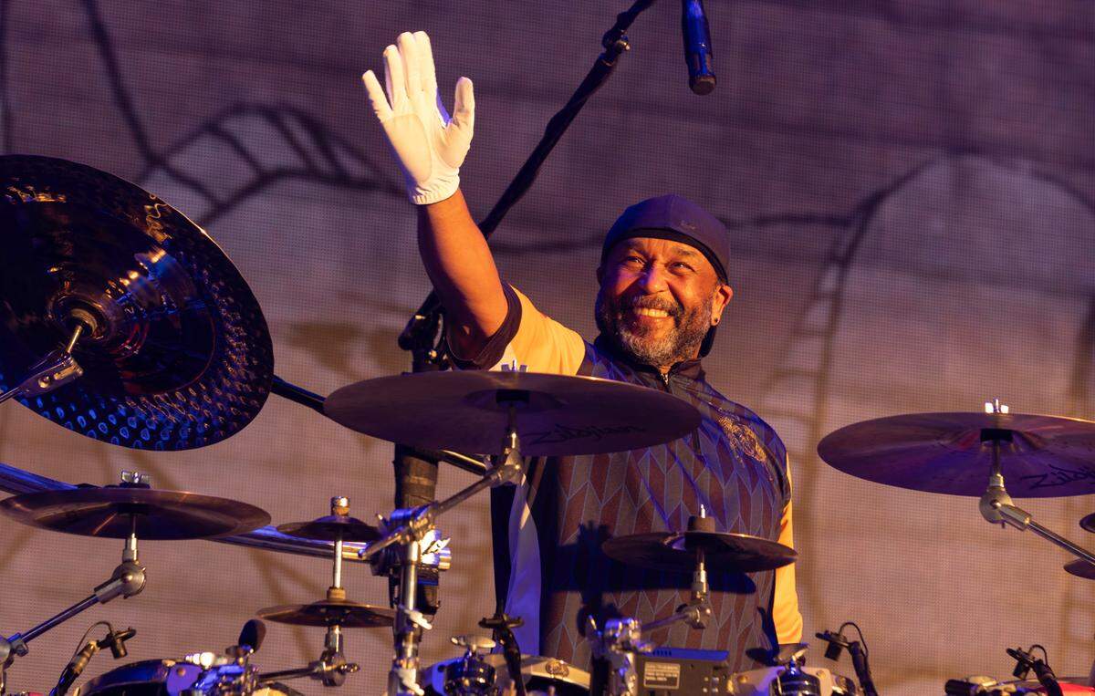 Drummer Carter Beauford waves to fans as The Dave Matthews Band takes the stage at Raleigh, N.C.’s Coastal Credit Union at Walnut Creek, Friday night, June 14, 2024.