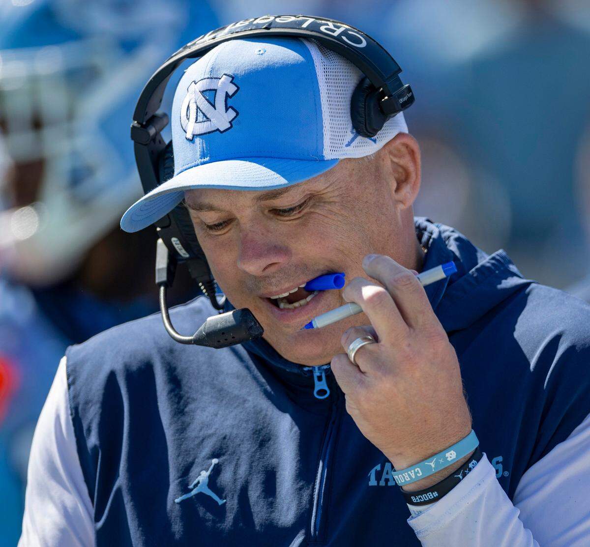 North Carolina defensive coordinator Geoff Collins makes notes prior to the kickoff against Georgia Tech on Saturday, October 12, 2024 at Kenan Stadium in Chapel Hill, N.C.
