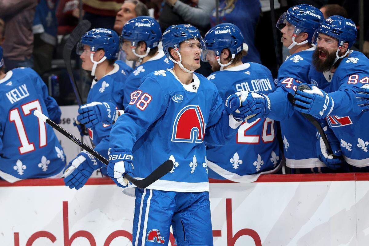 Martin Necas 88 of the Colorado Avalanche celebrates with his teammates after scoring against the Carolina Hurricanes in the third period at Ball Arena on Oct. 23, 2025 in Denver, Colorado.