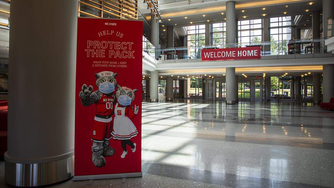 Signs in Talley Student Union at N.C. State University remind students who will be returning to campus for the fall semester to follow safety protocols in place to prevent the spread of COVID-19, on Wednesday, July 22, 2020, in Raleigh, N.C.
