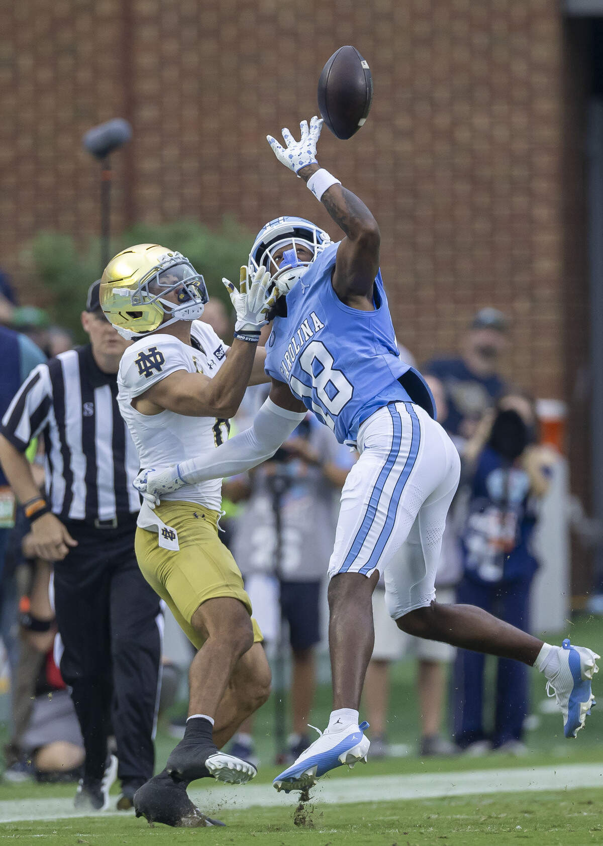 North Carolina defensive back Jaiden Patterson (18) breaks up a pass to Notre Dame wide receiver Jordan Faison in the first quarter on Saturday, Oct. 3, 2026, at Kenan Memorial Stadium in Chapel Hill, N.C.