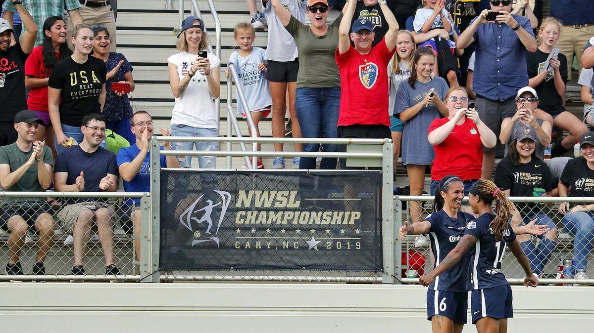 In this 2019 file photo, North Carolina Courage’s Jessica McDonald (14) celebrates her goal with Abby Erceg (6) during the NWSL championship game against the Chicago Red Stars in Cary, N.C. The Courage plan to resume play Wednesday after a league-wide boycott.