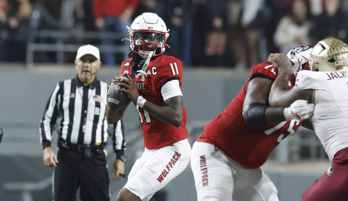 N.C. State quarterback CJ Bailey looks for a receiver during N.C. State’s game against Florida State at Carter-Finley Stadium in November 2025. 