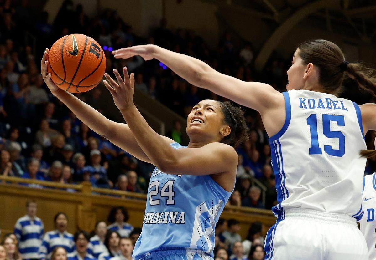 North Carolina’s Indya Nivar drives against Duke’s Emma Koabel during the first half of the Tar Heels’ game on Thursday, Feb. 27, 2025, at Cameron Indoor Stadium in Durham, N.C.