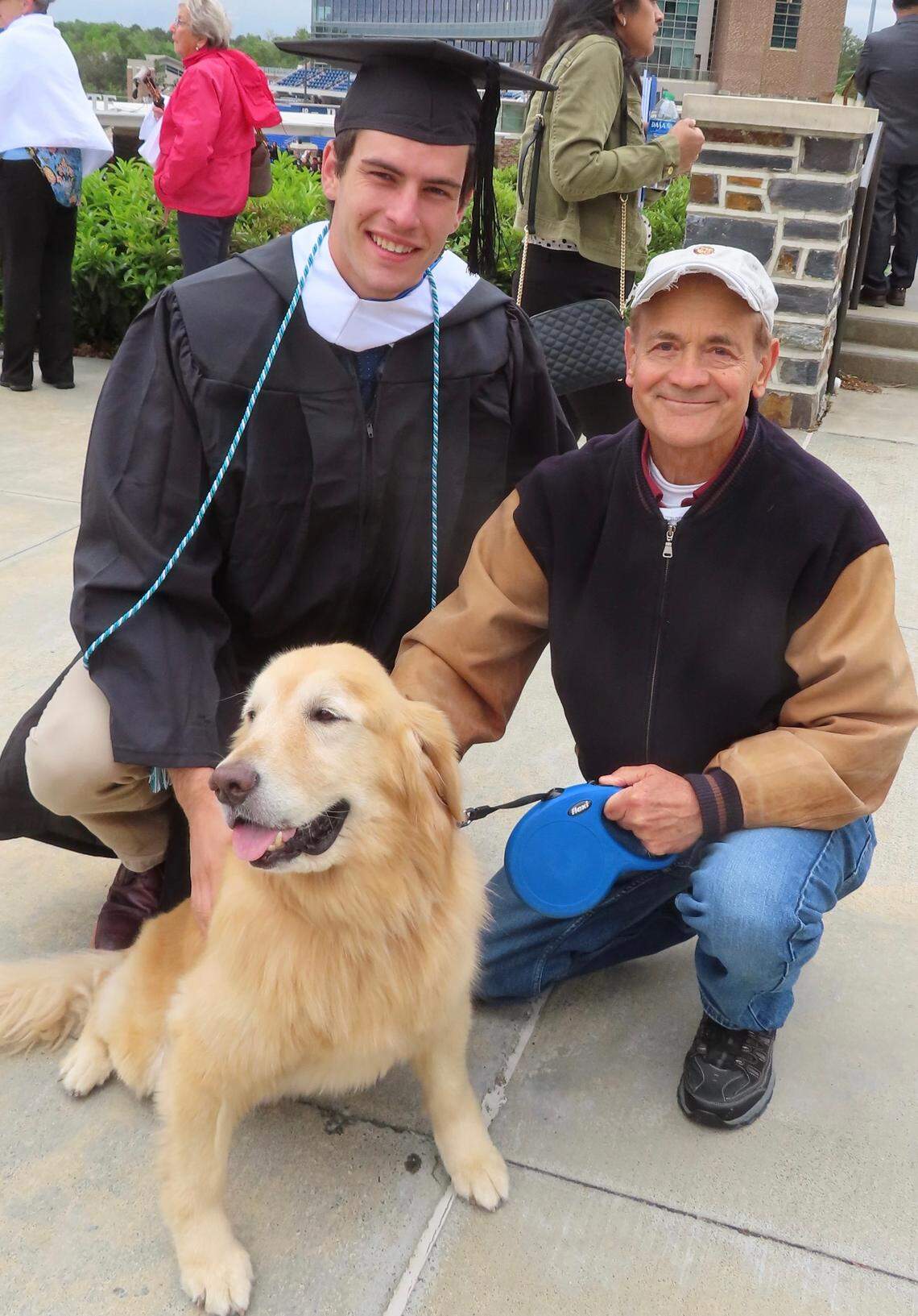 Nugget and Keith Upchurch greet new Duke University graduate Jake Jeffries after the commencement ceremony Sunday, May 8, 2022.