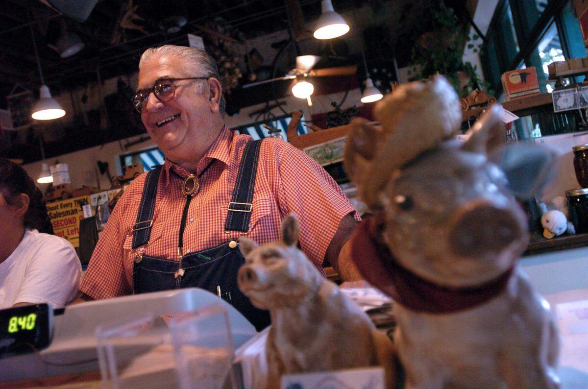 “Big Ed” Watkins operates the register at his City Market restaurant in 2004.