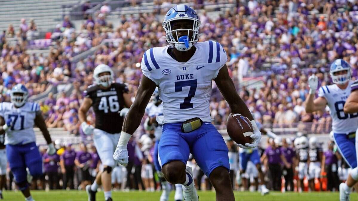 Duke running back Jordan Waters (7) runs for a touchdown against Northwestern during the first half of an NCAA college football game, Saturday, Sept.10, 2022, in Evanston, Ill. (AP Photo/David Banks)
