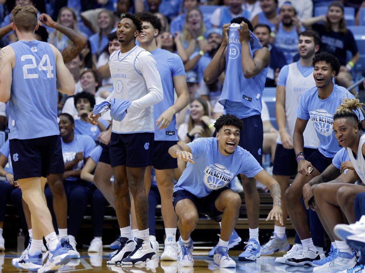North Carolina men’s basketball players react to a skills contest during “Live Action with Carolina Basketball” at the Dean E. Smith Center on Friday, Oct. 7, 2022, in Chapel Hill, N.C.