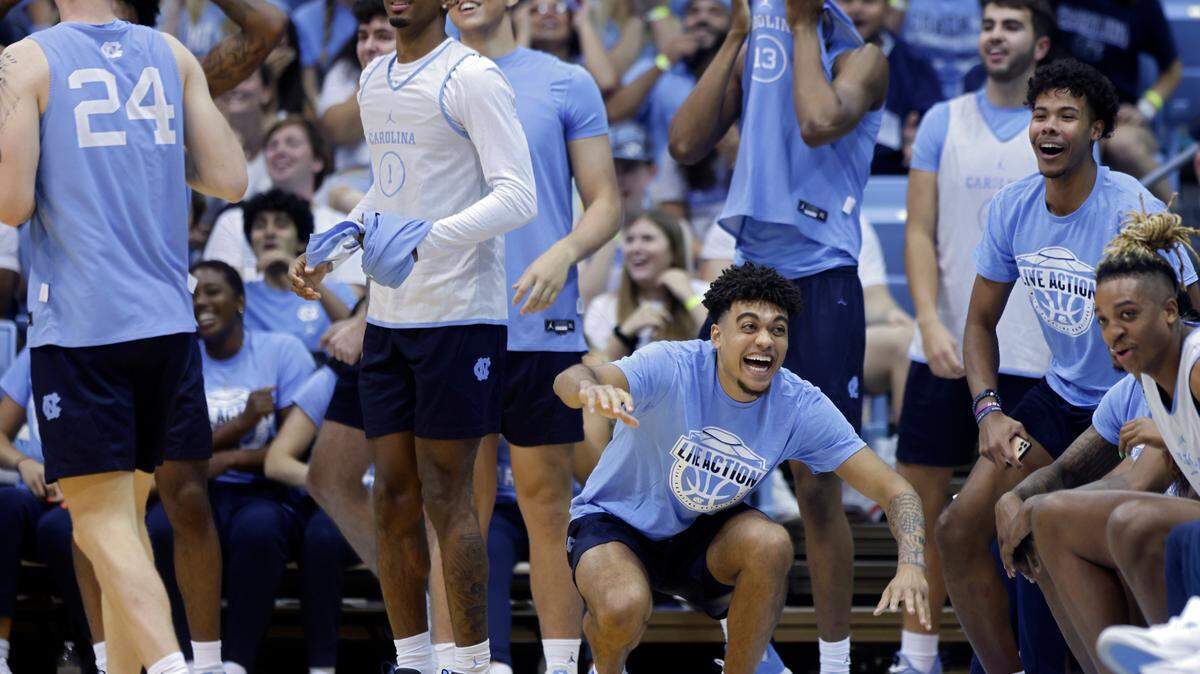 North Carolina men’s basketball players react to a skills contest during “Live Action with Carolina Basketball” at the Dean E. Smith Center on Friday, Oct. 7, 2022, in Chapel Hill, N.C.
