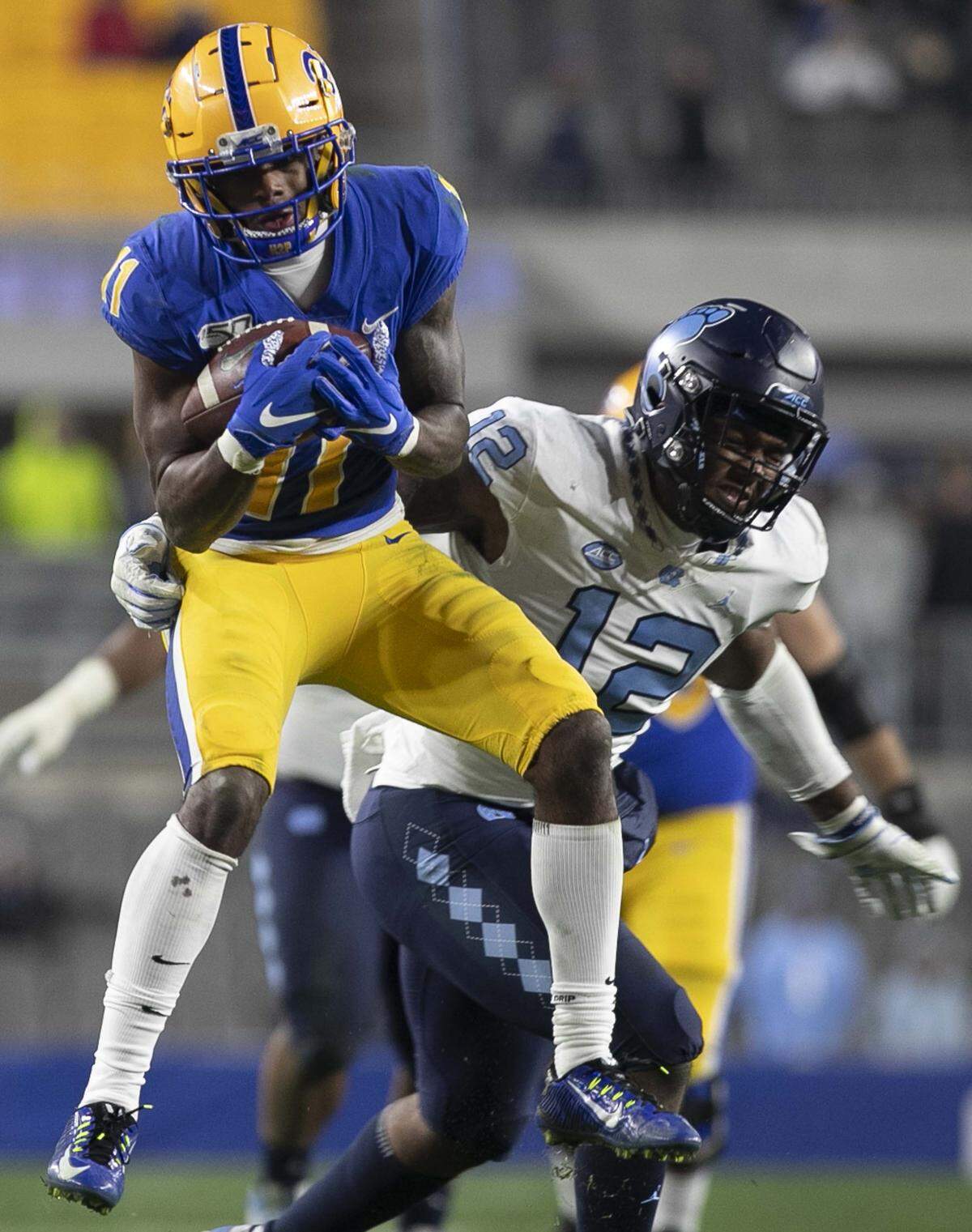 Pittsburgh’s Taysir Mack (11) pulls in a 15-yard pass from quarterback Kenny Pickett to set up the Panthers’ winning touchdown in overtime against North Carolina on Thursday, November 14, 2019 at Heinz Field in Pittsburgh, Pa.
