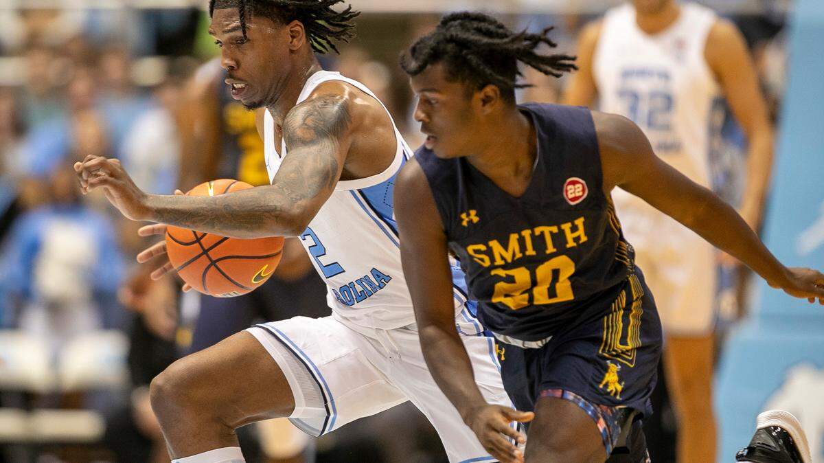 North Carolina’s Caleb Love (2) makes a steal against Johnson C. Smith’s Cedric Patterson (20) in the first half during an exhibition game on Friday, October 28, 2022 at the Smith Center in Chapel Hill, N.C.