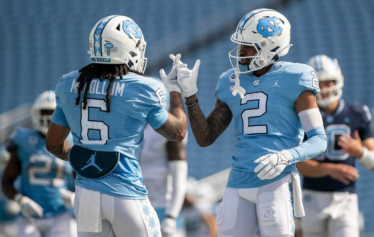 North Carolina wide receiver Gavin Blackwell (2) congratulates Nate McCollum (6) after a touchdown during the Tar Heels’ spring football game on Saturday, April 15, 2023 at Kenan Stadium in Chapel Hill, N.C.