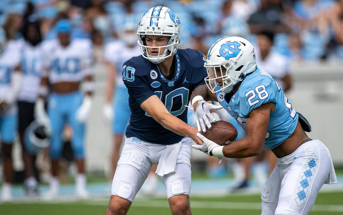 North Carolina running back Omarion Hampton (28) takes the hand off from quarterback Drake Maye (10) during the Tar Heels’ spring football game on Saturday, April 15, 2023 at Kenan Stadium in Chapel Hill, N.C.