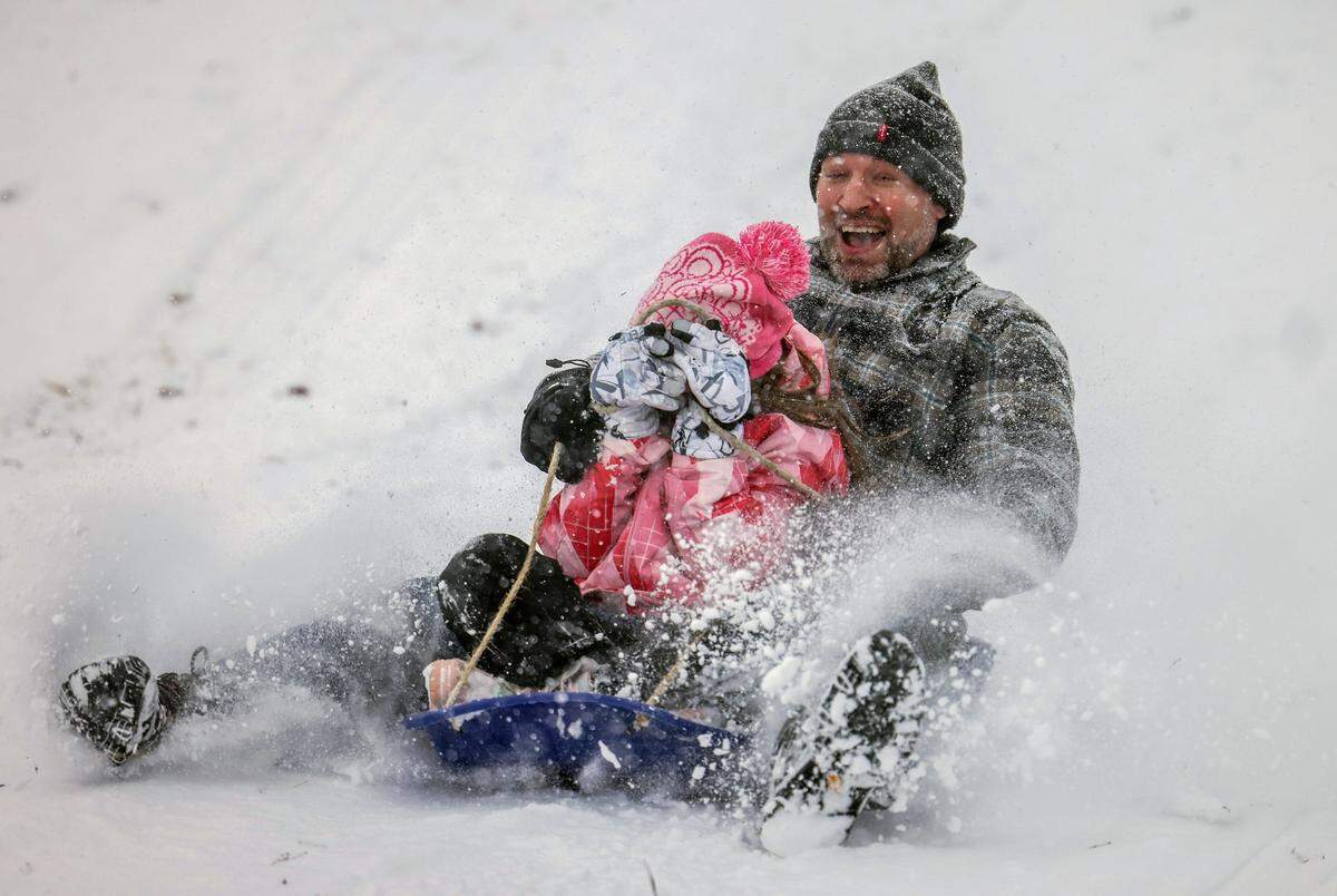 People sled in Cordelia Park in Charlotte, N.C., on Saturday, January 31, 2026.
