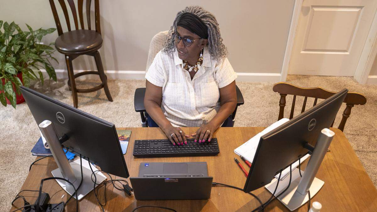 Retired state employee Margaret Reader still works part-time for the state, from her home in Clayton, N.C. on Thursday, September 18, 2025.  Reader sees first hand how delays in passing a state budget affects the state employee she serves. A delayed budget makes handing out pay raises and other benefits much more time consuming and tedious.  