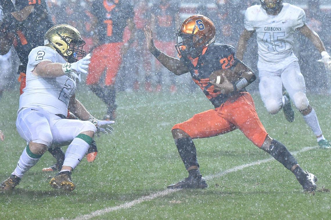 Cardinal Gibbons’ Carter Scearce (2) slips while trying to defend Julius Chambers’ Camren Kennedy (22) in the first half. The Cardinal Gibbons Crusaders and the Julius Chambers Cougars met in the NCHSAA 4A Football Championship game in Raleigh, N.C. on December 11, 2021.
