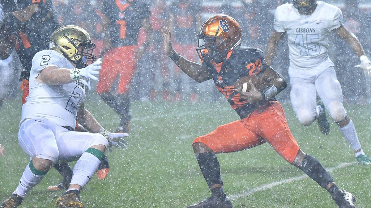 Cardinal Gibbons’ Carter Scearce (2) slips while trying to defend Julius Chambers’ Camren Kennedy (22) in the first half. The Cardinal Gibbons Crusaders and the Julius Chambers Cougars met in the NCHSAA 4A Football Championship game in Raleigh, N.C. on December 11, 2021.