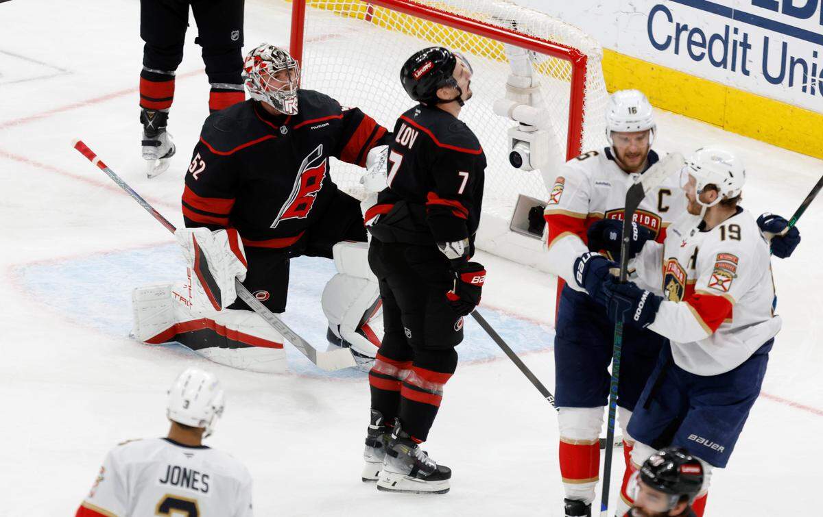 Carolina’s Pyotr Kochetkov (52) and Dmitry Orlov (7) react after Panthers’ Aleksander Barkov (16) scored in the third period of the Florida Panthers’ 5-0 victory over the Carolina Hurricanes in Game 2 of the Eastern Conference Final at the Lenovo Center in Raleigh, N.C., Thursday, May 22, 2025.