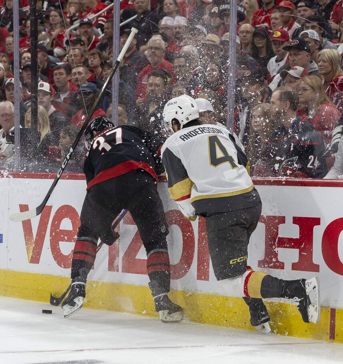 Vegas defenseman Rasmus Andersson (4) looses his stick as he battles of the puck with Carolina Hurricanes right wing Andrei Svechnikov (37) in the first period in Game 5 of the Stanley Cup Final against Vegas, on Thursday, June 11, 2026 at Lenovo Center in Raleigh, N.C.