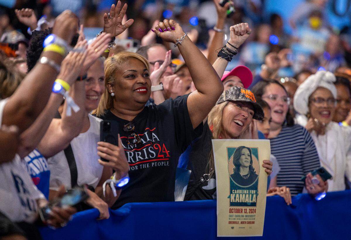 Supporters of Vice President Kamala Harris, the Democratic Presidential nominee, applaud her arrival at Minges Coliseum on Sunday, October 13, 2024 in Greenville, N.C.