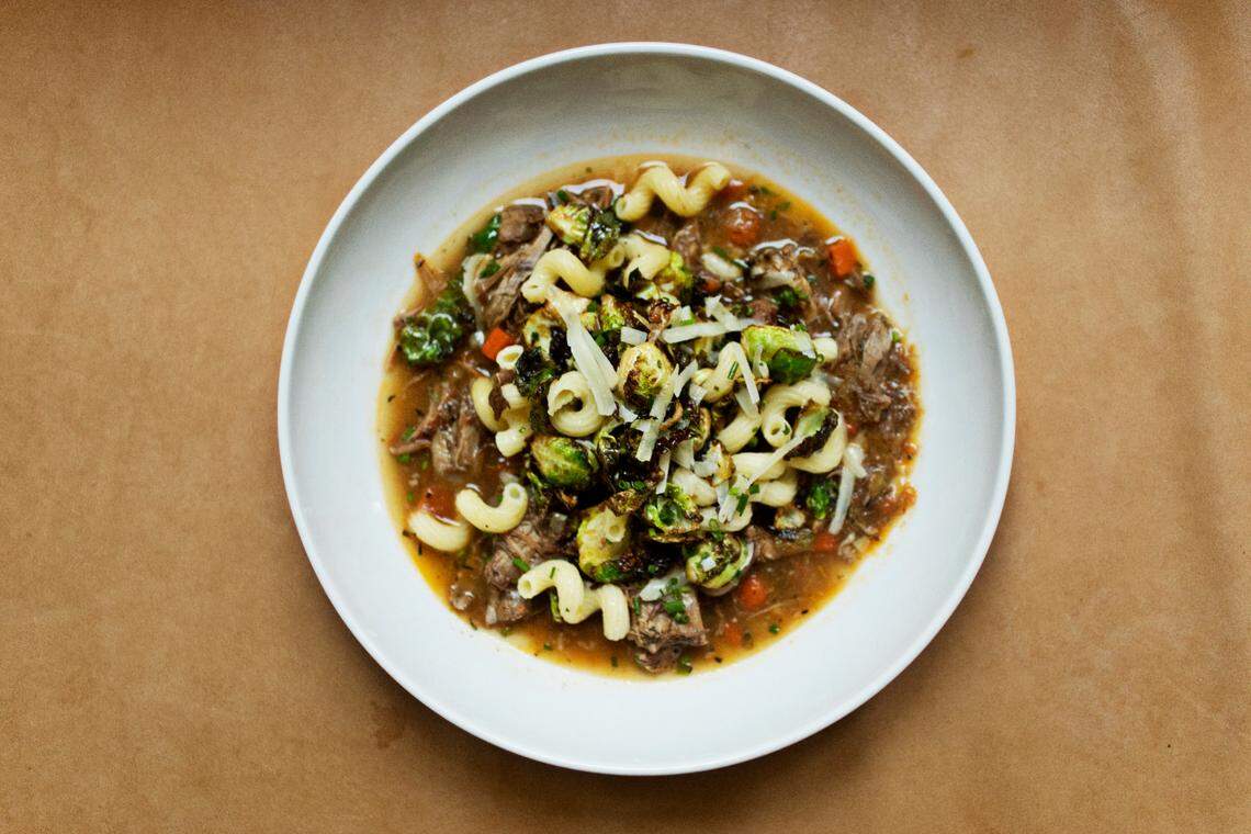 Braised NC pork & beef ragout with crispy brussel sprouts and cavatappi pasta at The Durham on Thursday, Feb. 24, 2022.